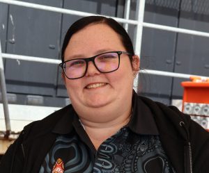 Tiarna O'Loughlin is pictured with her hair pulled back, wearing glasses and a dark shirt.