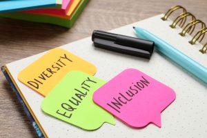 Note Book with post it notes that read Diversity, Equality and Inclusion